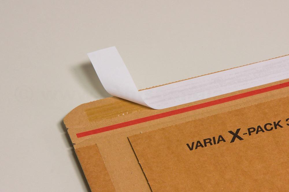 Buchverpackung mit Haftklebeverschluss